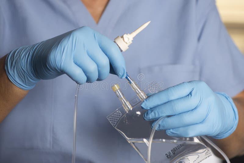 Nurse Prepares Dextrose Infusion