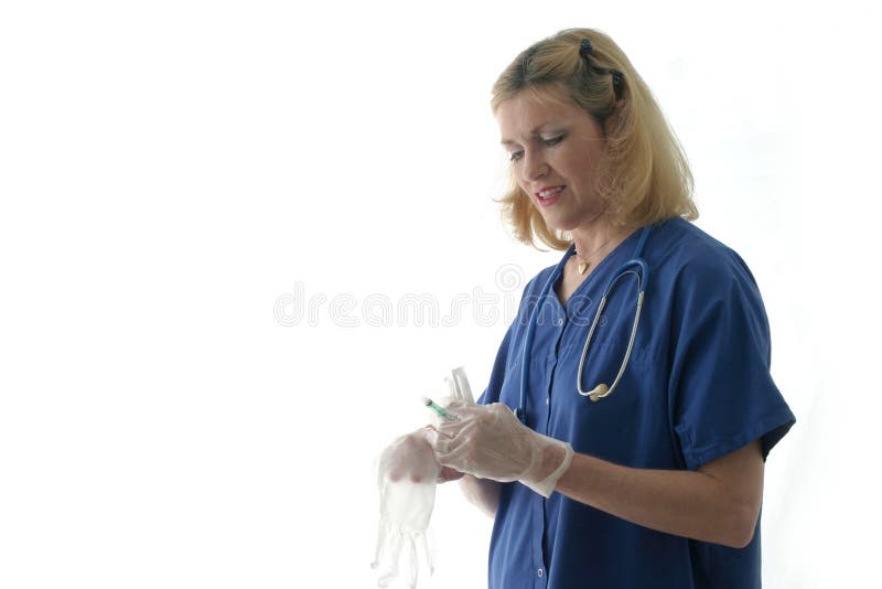 Nurse putting on gloves