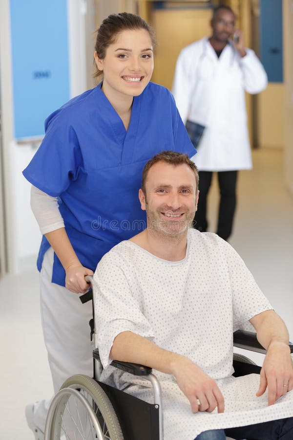 Nurse Taking Care Patient in Wheelchair Stock Image Image of