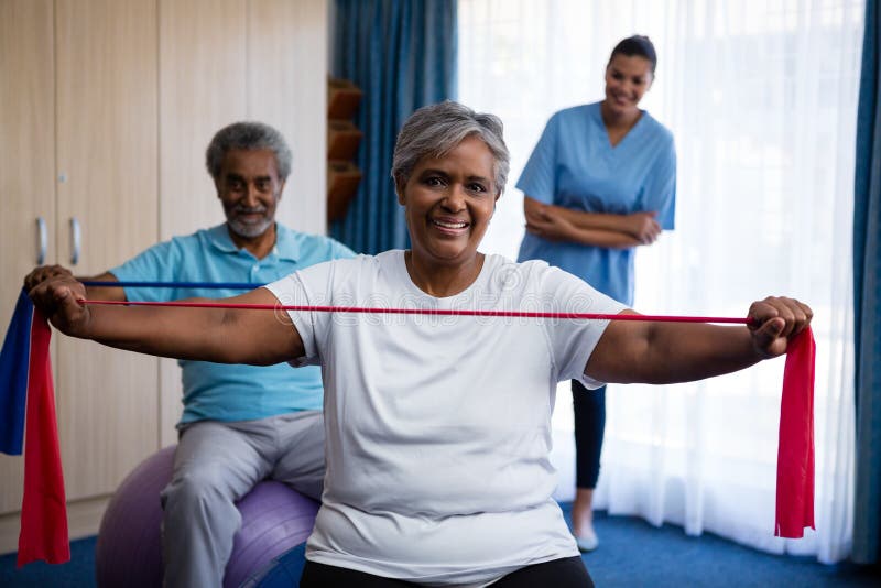 Nurse Training Seniors At Nursing Home Stock Image - Image of living