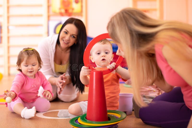 Nursery babies group have a fun in kindergarten gym royalty free stock images Nursery babies group have a fun in kindergarten gym royalty free stock images