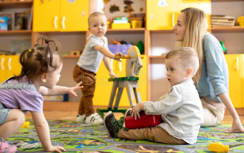 Nursery babies playing in kindergarten stock images Nursery babies playing in kindergarten stock images