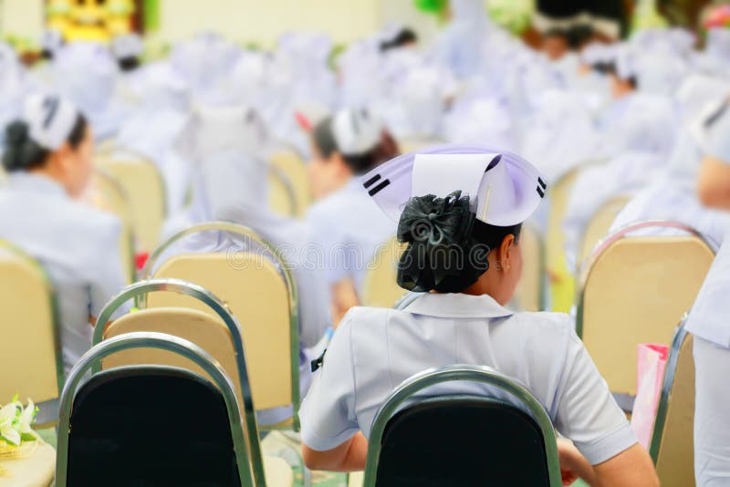 Nurses meeting seminar in room and presentation in conference hall hospital countryside select focus with shallow depth of field