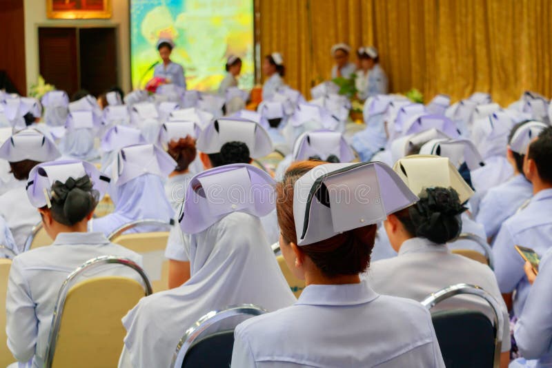 Nurses meeting seminar in room and presentation in conference hall hospital countryside select focus with shallow depth of field