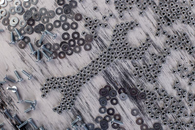 Nussschlüssel von den Metallnüssen, Bolzenhintergrund Flache Lage stockbild Nussschlüssel von den Metallnüssen, Bolzenhintergrund Flache Lage stockbild