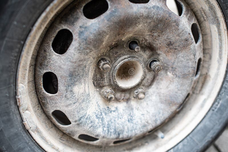 The nut of the used car wheel is screwed out royalty free stock images