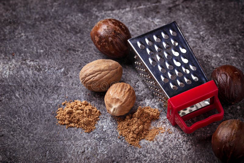 Nutmeg and grater stock image