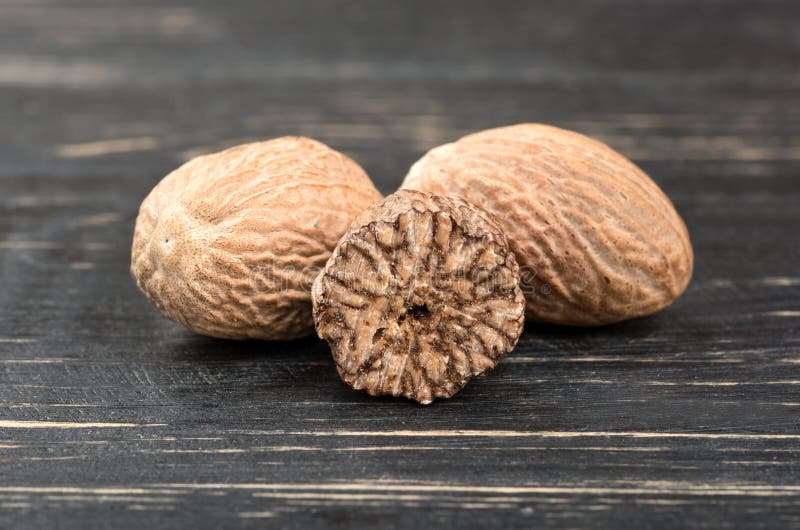 Two Nutmeg And Half With Powder In A Scoop Isolated On White Background Stock Photo Image of