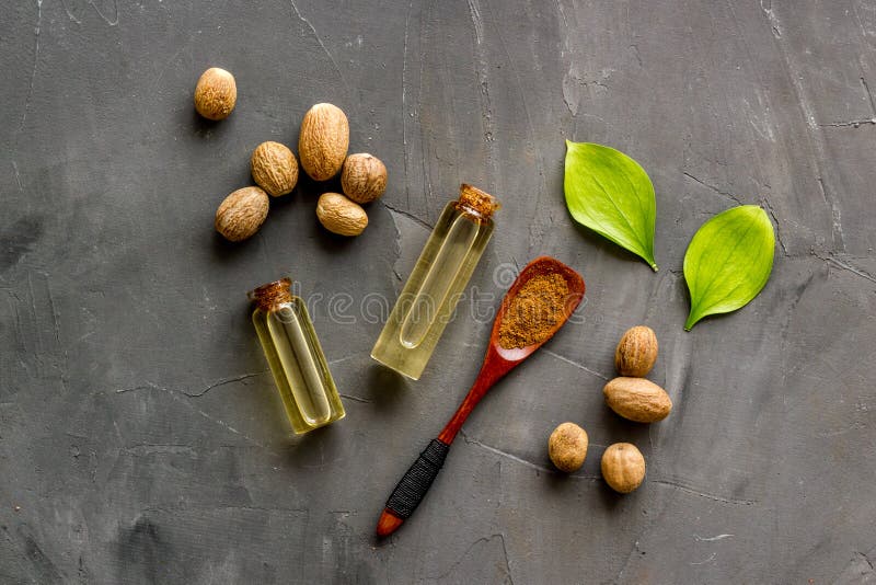 Nutmeg Oil Perfume Ingredient on Grey Background Topdown Stock