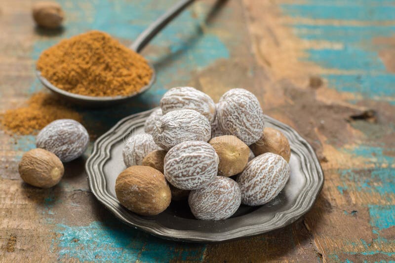 Nutmeg Powder. Macro View Whole Nuts And Grated Muscat Nuts. Stock