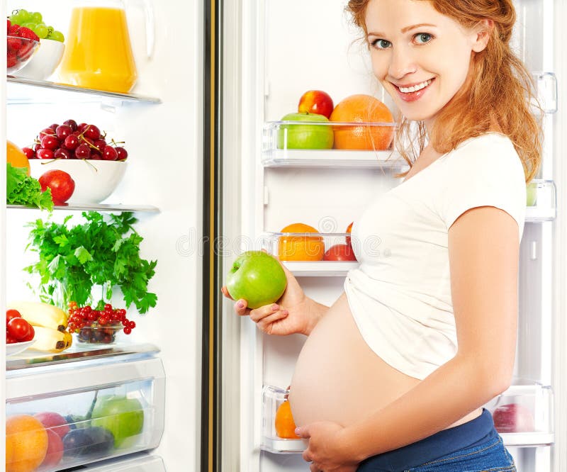 Nutrition and diet during pregnancy. Pregnant woman with fruits