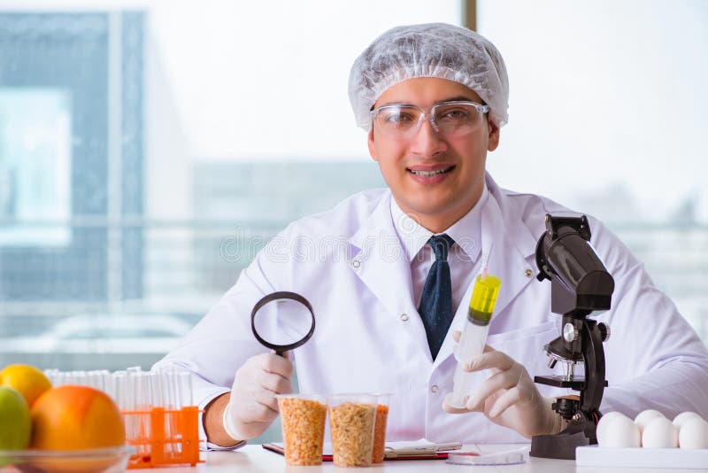 The nutrition expert testing food products in lab. Fruit, apple.