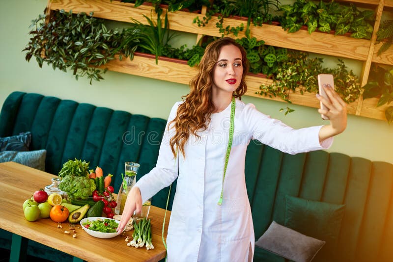 Nutritionist desk with healthy food, and measuring tape. Dietitian working on diet plan and Consultants in home care online. stock photos Nutritionist desk with healthy food, and measuring tape. Dietitian working on diet plan and Consultants in home care online. stock photos