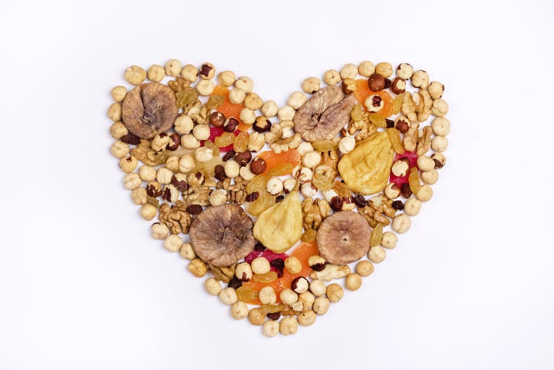 Nuts Mix and Dried Fruits in Heart Shape on White Background Top View