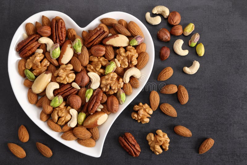 Nuts on a Plate in the Shape of a Heart Stock Image Image of green