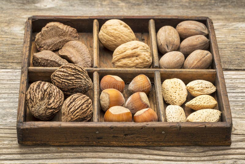 Nuts in rustic wooden box royalty free stock photo