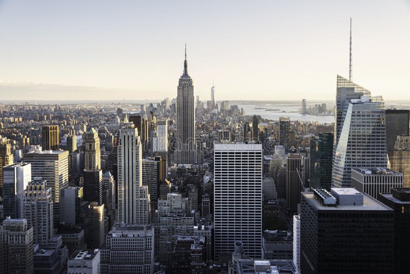 Aerial view of the Empire State Building and downtown Manhattan on a clear day at dusk, New York City. Aerial view of the Empire State Building and downtown Manhattan on a clear day at dusk, New York City.