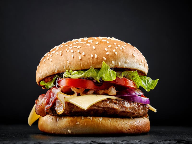 Fresh tasty burger on black background. Fresh tasty burger on black background