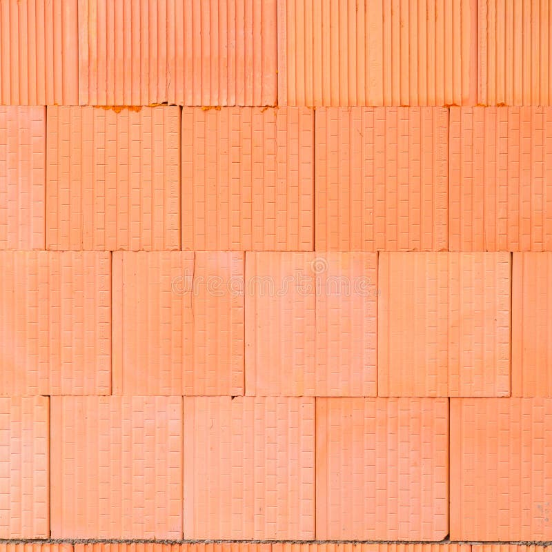 Ny orange bakgrund för tegelstenvägg Begrepp för arbetare för husbyggnad arkivbilder Ny orange bakgrund för tegelstenvägg Begrepp för arbetare för husbyggnad arkivbilder