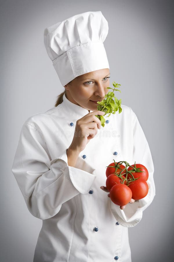 Female chef with fresh, natural ingredients. Female chef with fresh, natural ingredients