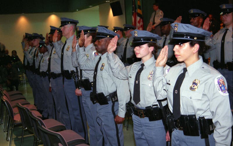 Police officer of numerous ethnic backgrounds getting sworn in at the District 3 station in Kentland,Maryland. Police officer of numerous ethnic backgrounds getting sworn in at the District 3 station in Kentland,Maryland