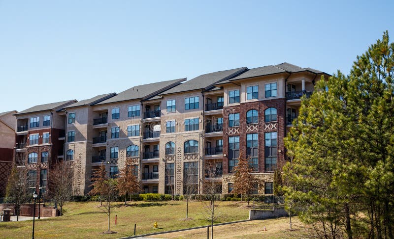 New brick and stucco apartments or condos under a clear blue sky. New brick and stucco apartments or condos under a clear blue sky