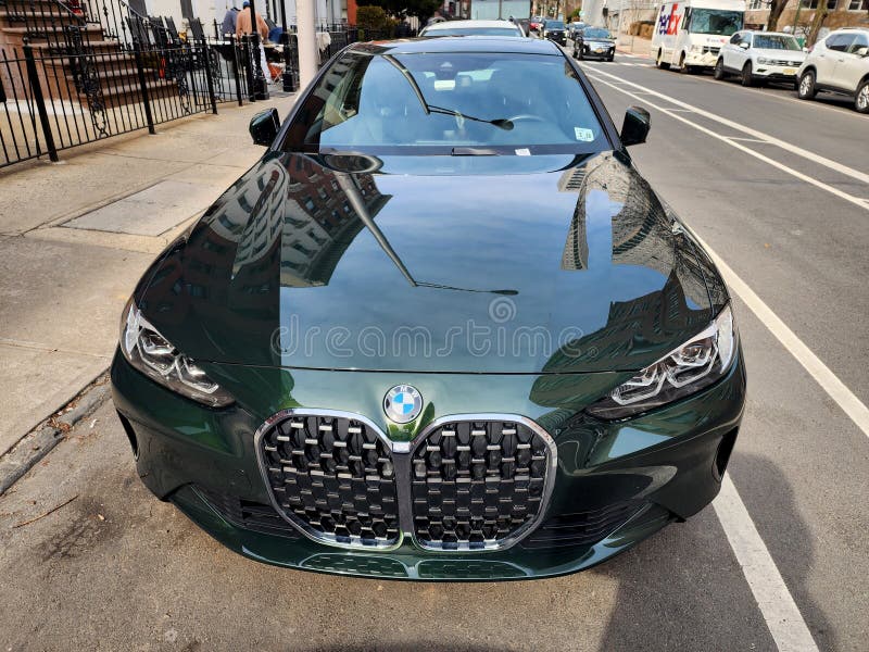 New York City, USA - February 27, 2024: BMW 4 luxurious car parked in the street, top view. New York City, USA - February 27, 2024: BMW 4 luxurious car parked in the street, top view.