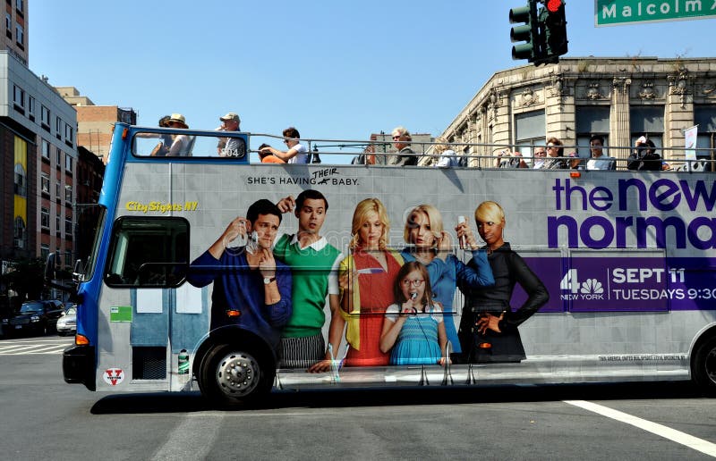NYC: Double-decker Tourist Bus in Harlem royalty free stock photos