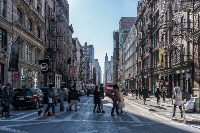 NYC/USA 02 JAN 2018 - People crossing the crosswalk on New York Street.