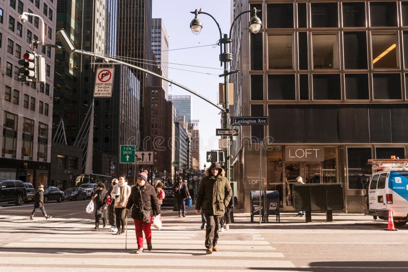 NYC/USA 02 JAN 2018 - People crossing the crosswalk on New York Street.