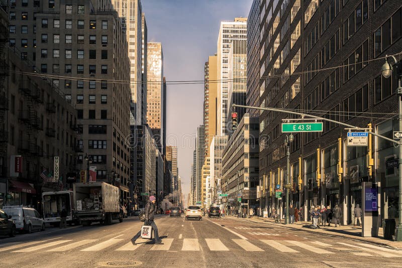 NYC/USA 02 JAN 2018 - People crossing the crosswalk on New York Street.