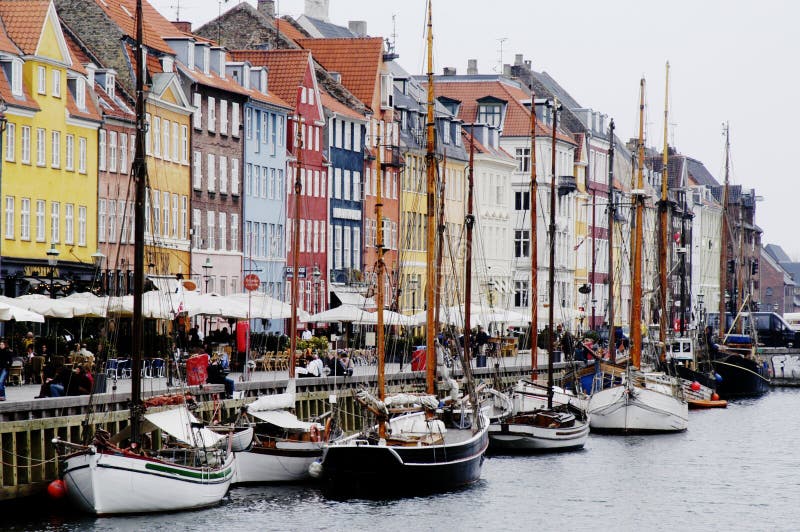 Waterfront with sidewalk cafes and restuarants overlooking the Nyhavn harbour in Copenhagen, Denmark. Waterfront with sidewalk cafes and restuarants overlooking the Nyhavn harbour in Copenhagen, Denmark