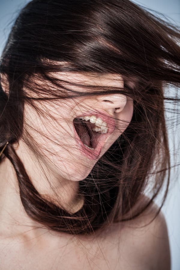 Portrait of a young woman shouting in ecstasy. Portrait of a young woman shouting in ecstasy