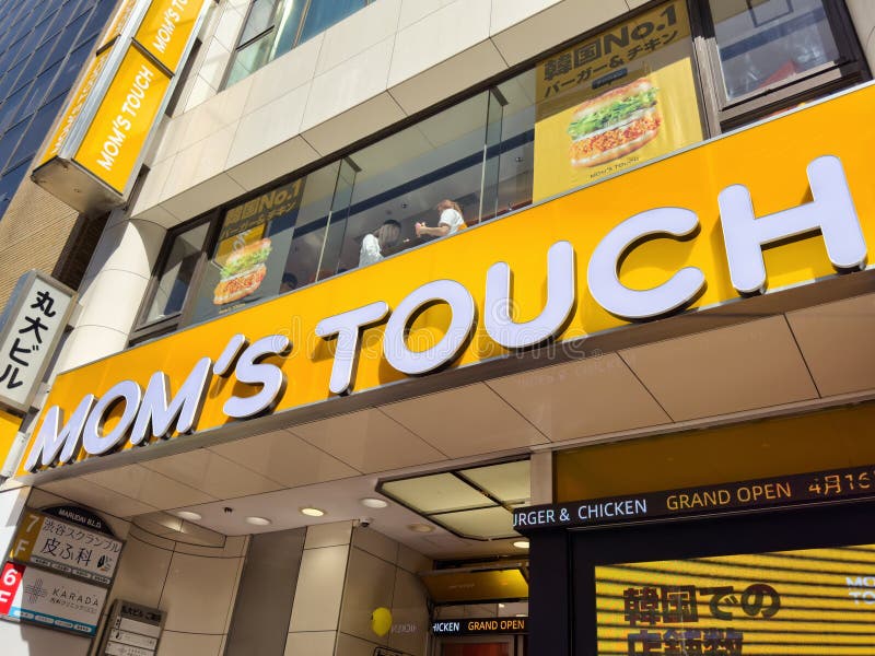 TOKYO, JAPAN - APRIL 19, 2024: Newly opened Mom's Touch restaurant in Shibuya, Tokyo. Mom's Touch is a chicken burger chain based in South Korea. TOKYO, JAPAN - APRIL 19, 2024: Newly opened Mom's Touch restaurant in Shibuya, Tokyo. Mom's Touch is a chicken burger chain based in South Korea.