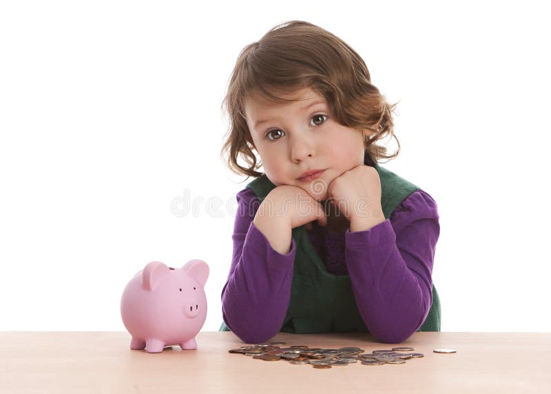 Adorable preschooler looking sad that she doesn't have enough money in her piggy bank. Isolated on white. Adorable preschooler looking sad that she doesn't have enough money in her piggy bank. Isolated on white.