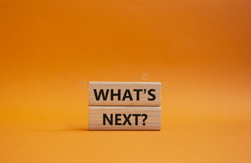 What is next symbol. Concept word What is next on wooden blocks. Beautiful orange background. Business and What is next concept. Copy space. What is next symbol. Concept word What is next on wooden blocks. Beautiful orange background. Business and What is next concept. Copy space