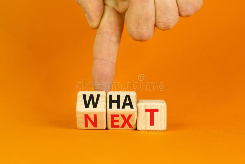 What next symbol. Concept words What next on wooden blocks. Changed words what to next. Beautiful orange table orange background. Businessman hand. Business What next concept. Copy space. What next symbol. Concept words What next on wooden blocks. Changed words what to next. Beautiful orange table orange background. Businessman hand. Business What next concept. Copy space