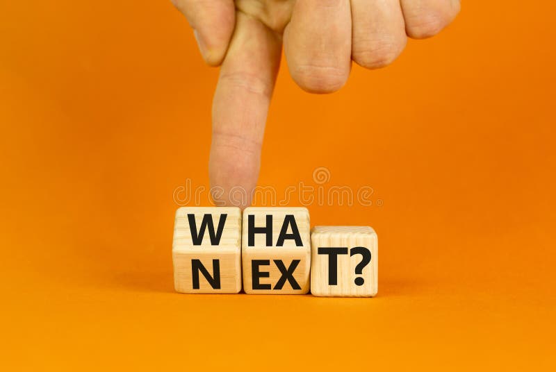 What next symbol. Concept words What next on wooden blocks. Changed words what to next. Beautiful orange table orange background. Businessman hand. Business What next concept. Copy space. What next symbol. Concept words What next on wooden blocks. Changed words what to next. Beautiful orange table orange background. Businessman hand. Business What next concept. Copy space