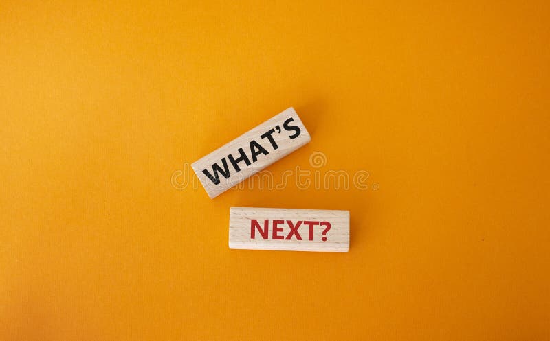 What is next symbol. Concept words What is next on wooden blocks. Beautiful orange background. Business and What is next concept. Copy space. What is next symbol. Concept words What is next on wooden blocks. Beautiful orange background. Business and What is next concept. Copy space.