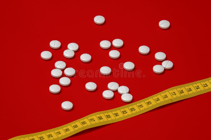 Nähren Sie Konzept Abnehmen mit Pillen, abletes, gefährlich für Gesundheit Magersucht, Bulimie - gefährlich lizenzfreie stockbilder Nähren Sie Konzept Abnehmen mit Pillen, abletes, gefährlich für Gesundheit Magersucht, Bulimie - gefährlich lizenzfreie stockbilder