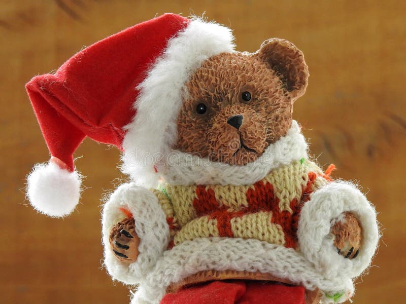 Närbild av en gullig liten leksakbjörn som kläs som Santa Claus royaltyfri fotografi Närbild av en gullig liten leksakbjörn som kläs som Santa Claus royaltyfri fotografi