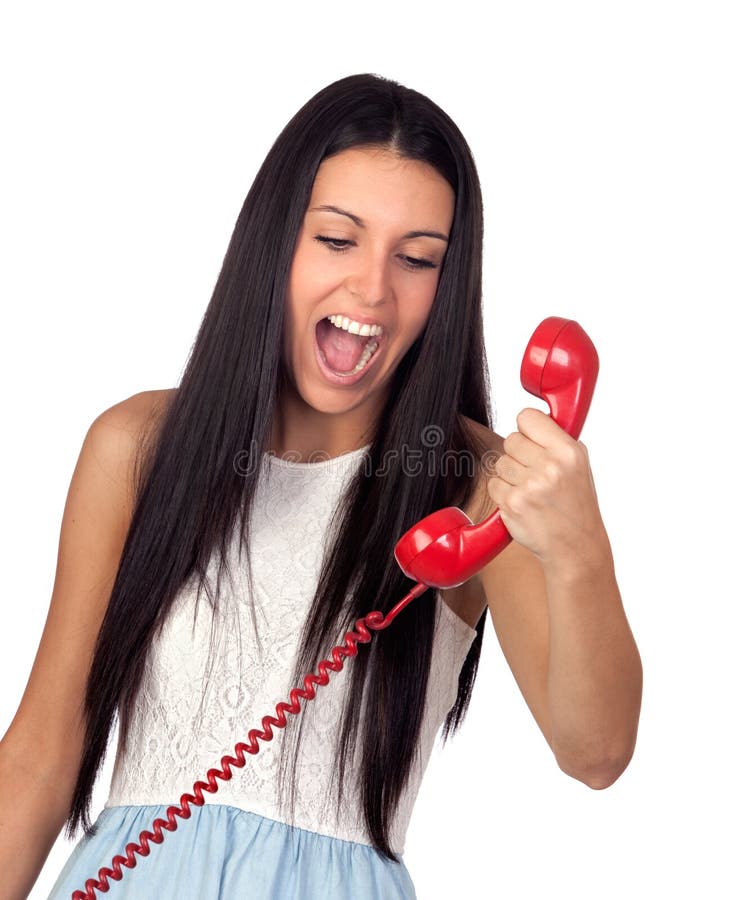 Pretty brunette woman screaming on the phone isolated over white. Pretty brunette woman screaming on the phone isolated over white