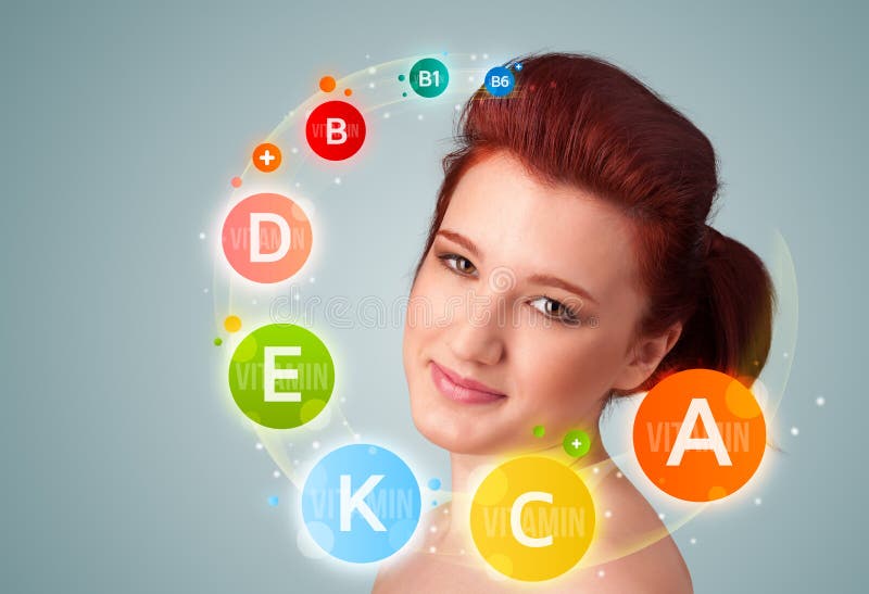 Nätt ung flicka med färgrika vitaminsymboler och symboler arkivfoto Nätt ung flicka med färgrika vitaminsymboler och symboler arkivfoto