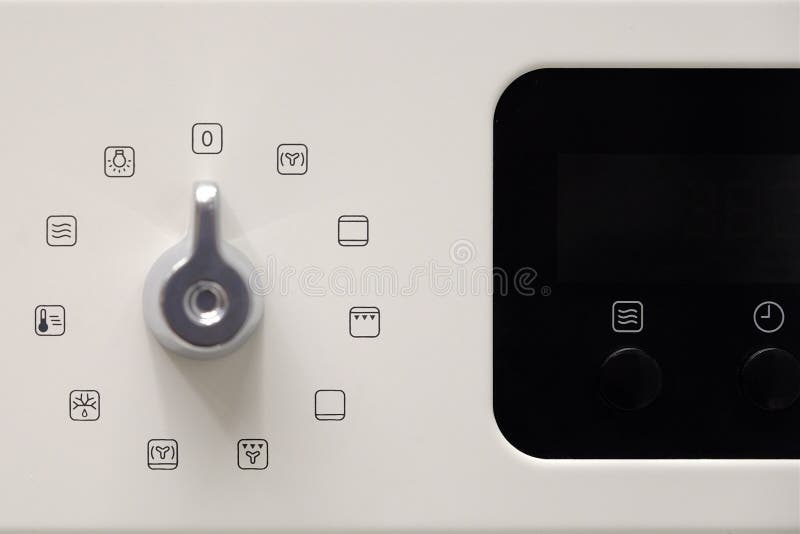 O botão controla a posição dos modos para cozinhar no forno opinião do close-up de cima de imagem de stock O botão controla a posição dos modos para cozinhar no forno opinião do close-up de cima de imagem de stock