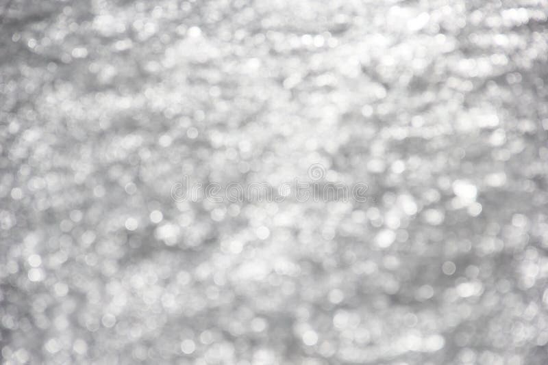 O branco Sparkles em Gray Background imagens de stock royalty free O branco Sparkles em Gray Background imagens de stock royalty free