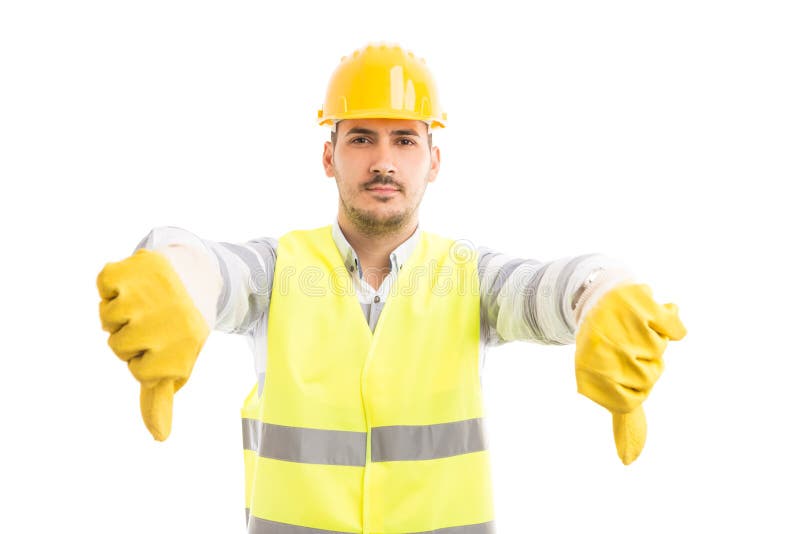 O construtor ou o coordenador do construtor que mostram os polegares gesticulam para baixo foto de stock royalty free O construtor ou o coordenador do construtor que mostram os polegares gesticulam para baixo foto de stock royalty free