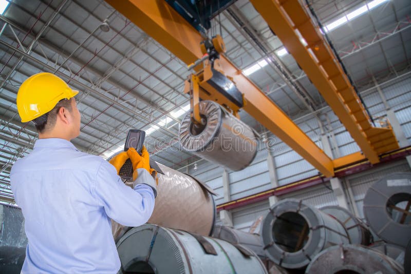 The engineer control the crane in the industrial. The engineer control the crane in the industrial