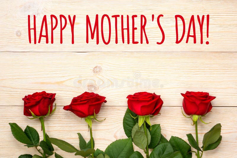 Happy mother`s day, greetings card with 4 red roses and white wooden background. Happy mother`s day, greetings card with 4 red roses and white wooden background