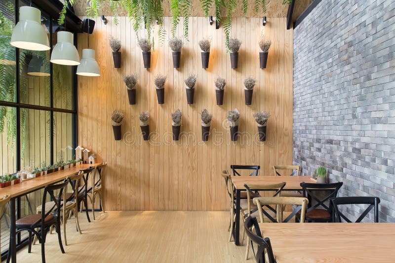 O estilo moderno do vintage do design de interiores do café para relaxa o backg do tempo