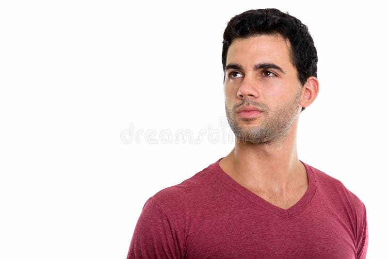 O estúdio disparou do homem latino-americano considerável novo que pensa quando lookin fotos de stock O estúdio disparou do homem latino-americano considerável novo que pensa quando lookin fotos de stock